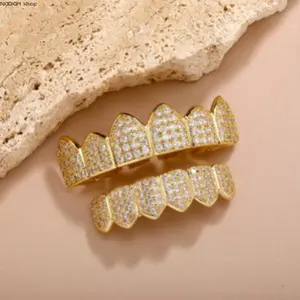Iced Out Fang Teeth Grillz with Cubic Zirconia, Hip Hop Mouth Jewelry in Gold & Silver, Bold Statement Dental Accessories for Rappers & Parties, Teeth Accessory