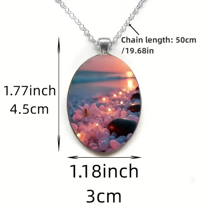 A beautiful summer beach ocean-themed oval-shaped silver alloy glass pendant and stainless steel chain
