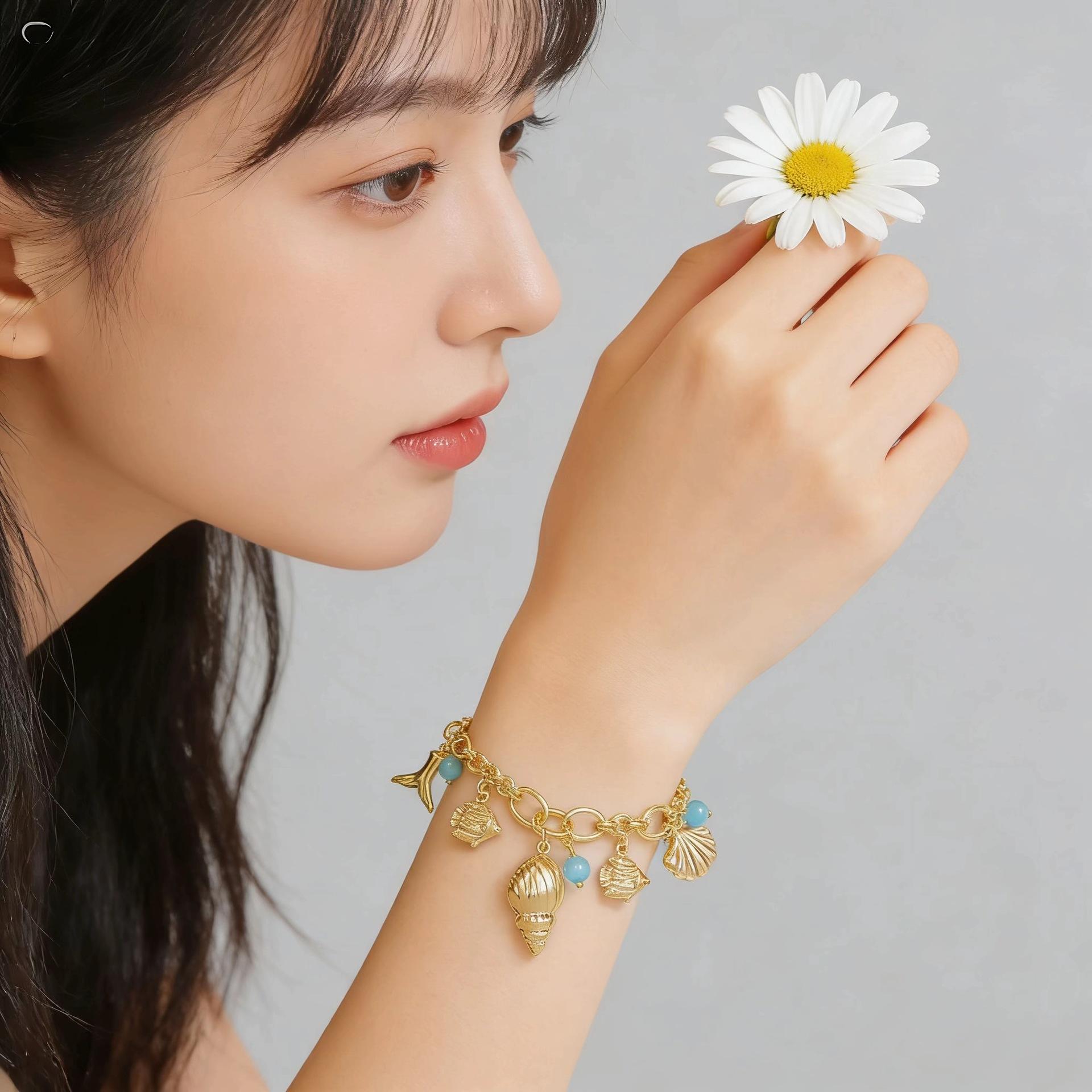 18K Gold Plated Ocean Inspired Bracelet with Shell Conch Mermaid Tail and Blue Cat Eye Stone Minimalist Stylish Design for Daily Wear