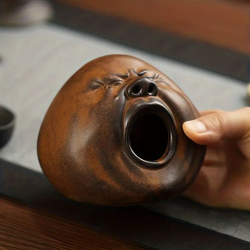 Creative screaming-face ceramic incense holder Burners, designed drawing on the primitive style of Shigaraki ware and full of oriental zen charm. It can serve as a decorative sculpture for meditation and altars.