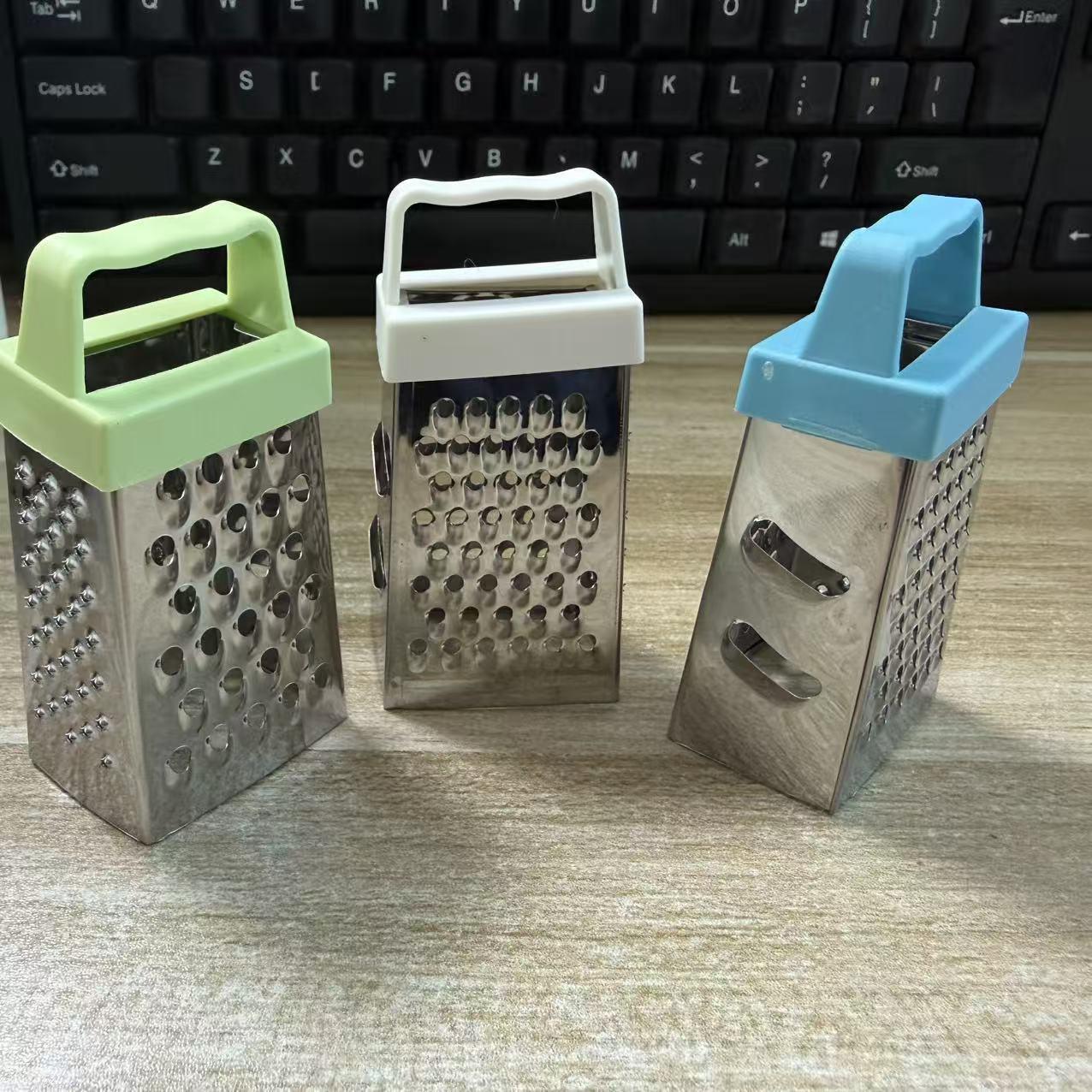 Multifunctional stainless steel household tool for peeling garlic, slicing vegetables and fruits, and shredding potatoes