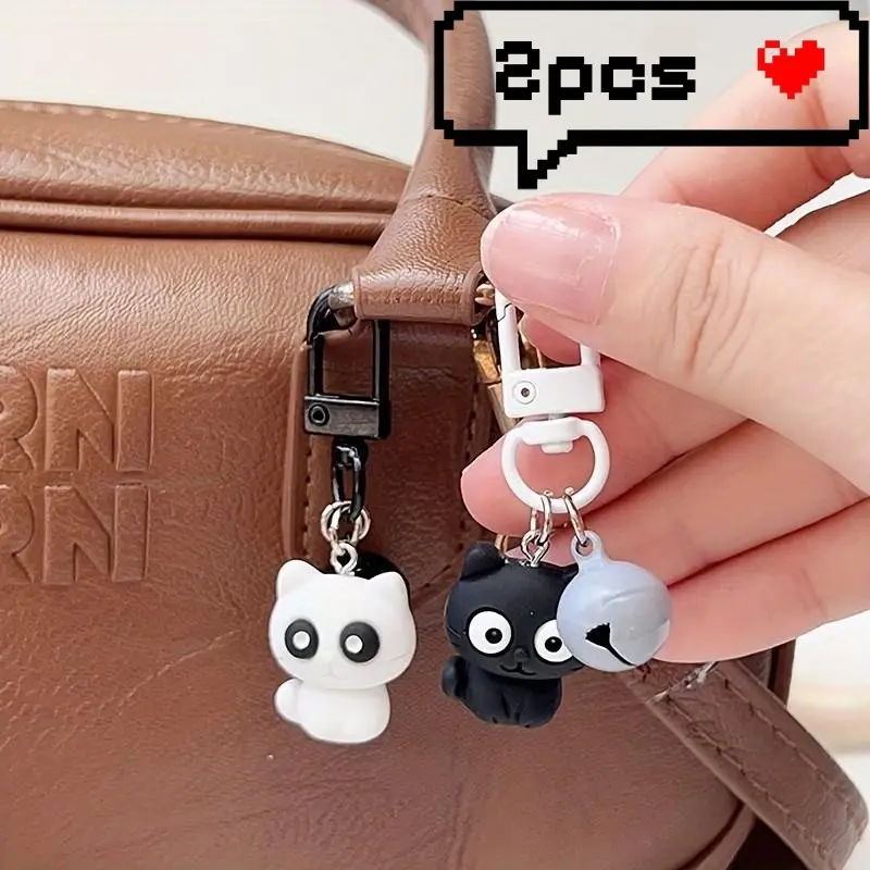 2 pieces of cartoon black-and-white kitten keychains. Simple and versatile soft and cute cat pendants. Suitable for student schoolbags and backpacks. Small and affordable accessories for teenage girls. Ideal gifts for friends or couples.