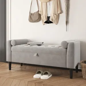 Upholstered storage ottoman bench with rolled armrests and wood legs. Multi-functional as seat and footrest for various indoor spaces