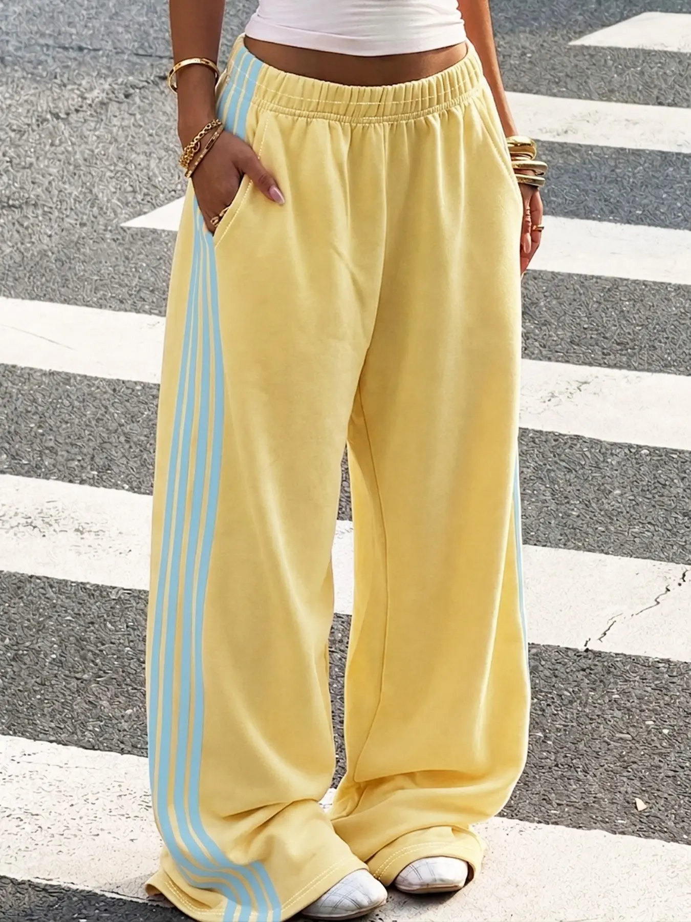 Unisex Cream & Blue Striped Baggy Sweatpants, Casual Streetwear, Trendy Party Bottoms, Cool Hip-Hop Style, Youthful High School Fashion