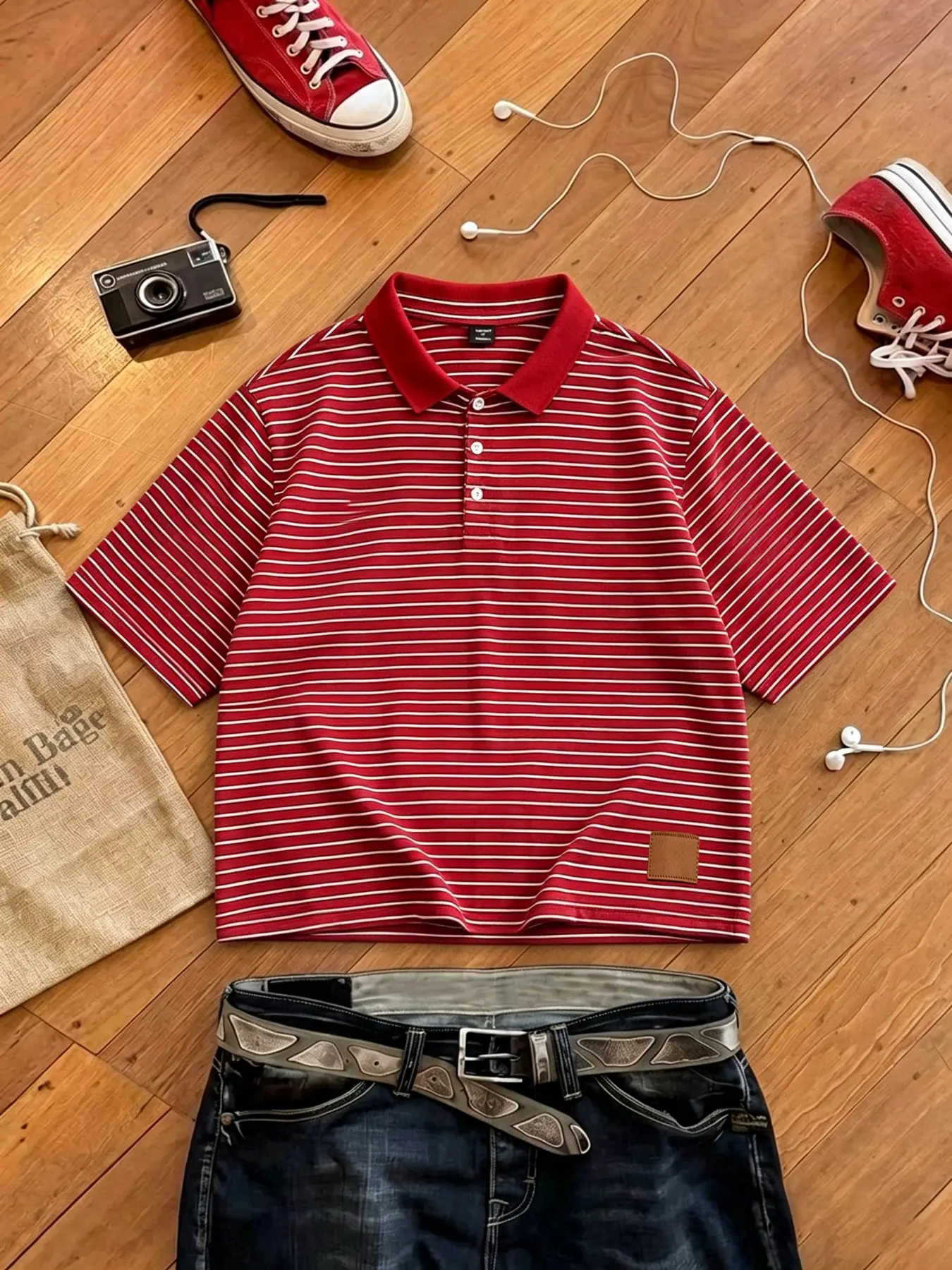 Men's polo shirt featuring a cotton fabric, red-and-white striped pattern, and a leather logo design; crafted from breathable, sweat-wicking material suitable for summer, with a relaxed, short-cut fit and a youthful, casual style.