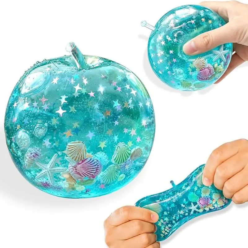 Apple soft rubber squeeze toy, blue ocean island style pressure reducing ball with glitter, slow rebound desktop display Apple soft rubber toy, transparent blue with star glitter effect, suitable for various holiday gifts