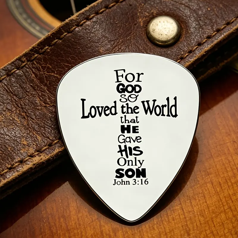 The stainless steel guitar pick engraved with scriptures, with a tough and devout rock atmosphere, is not only a professional pick that can be used normally, but also suitable as a baptism commemoration, a gift for players who love music, and a souvenir.