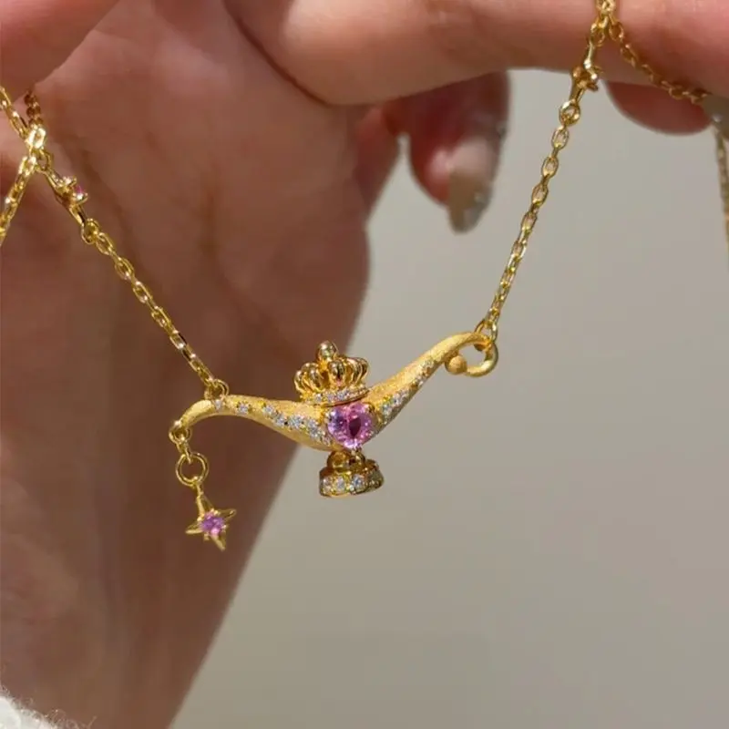"Power of Divine Wishes" - A unique, stylish, and exquisite gold-tone Aladdin's lamp necklace featuring a vintage-inspired, regal aesthetic; a stunning piece designed to sit elegantly at the collarbone.