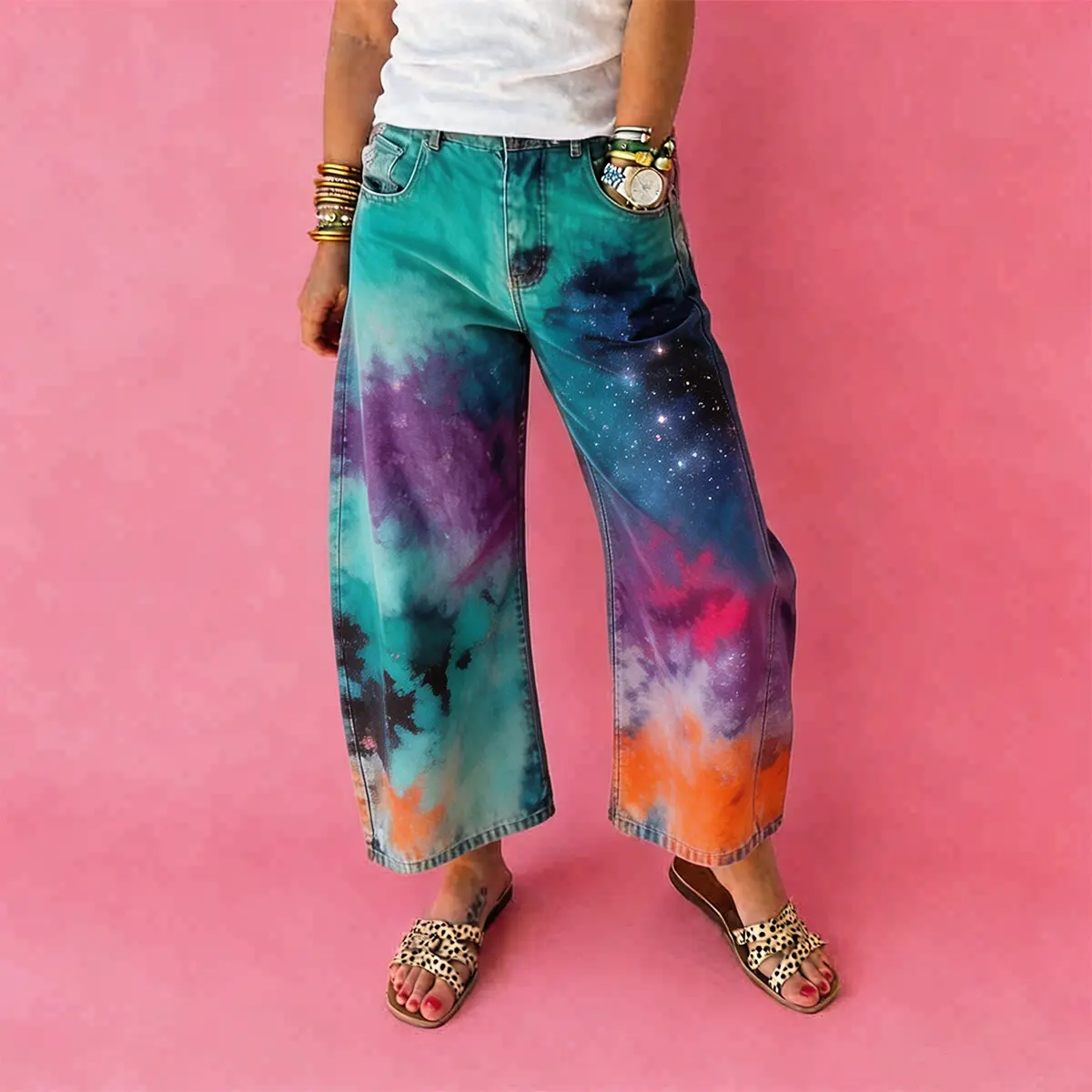 Women's vintage-wash wide-leg jeans; Y2K-style loose-fitting trousers; soft pink base with a bohemian floral print; suitable for year-round outdoor activities and streetwear styling.