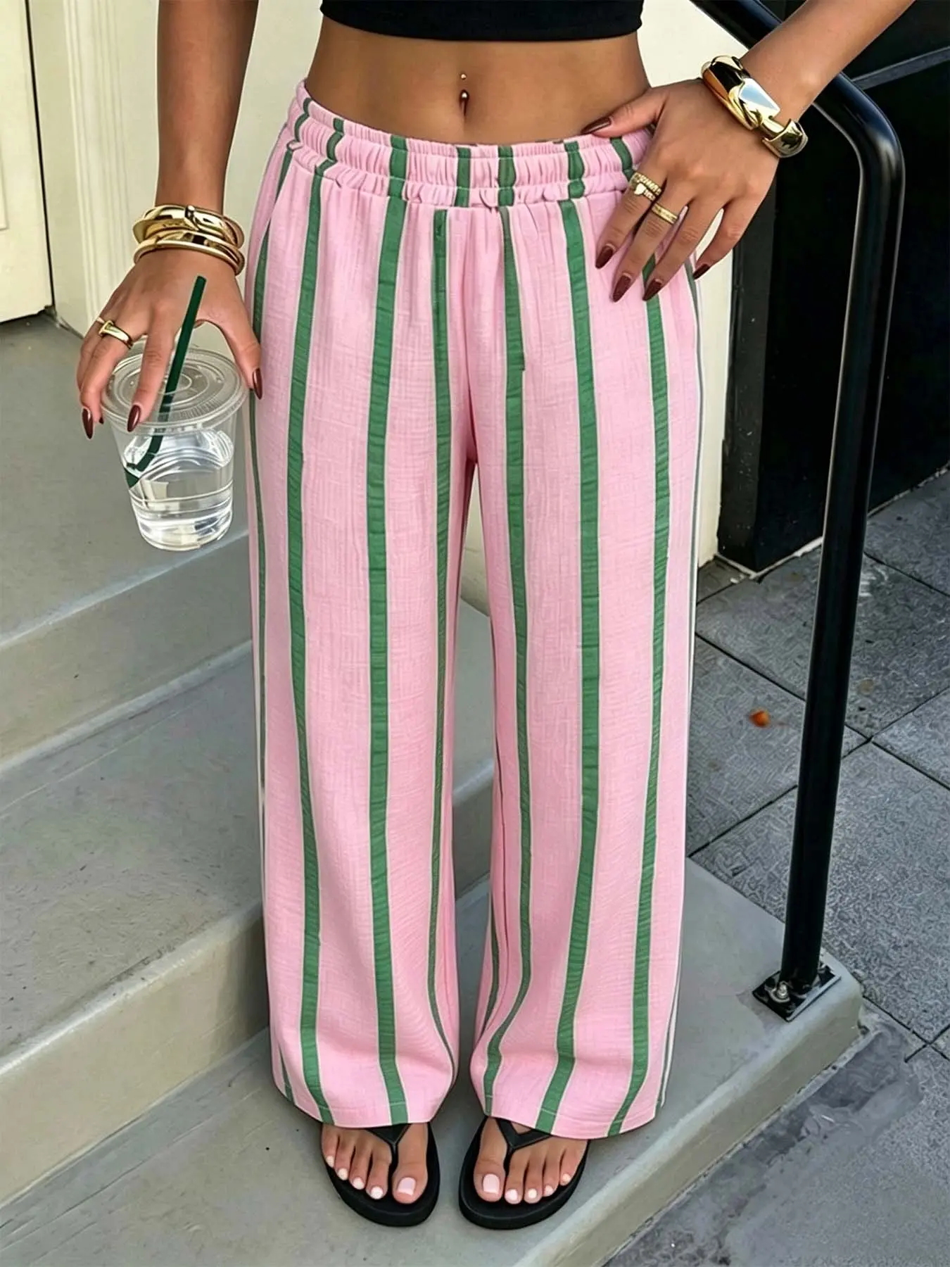 Women's striped wide-leg pants, featuring a high-waist elastic design with side pockets, soft and breathable casual striped pants, perfect choice for summer beach brunch and everyday outfits. #StripedPants #WideLegPants #CasualPants