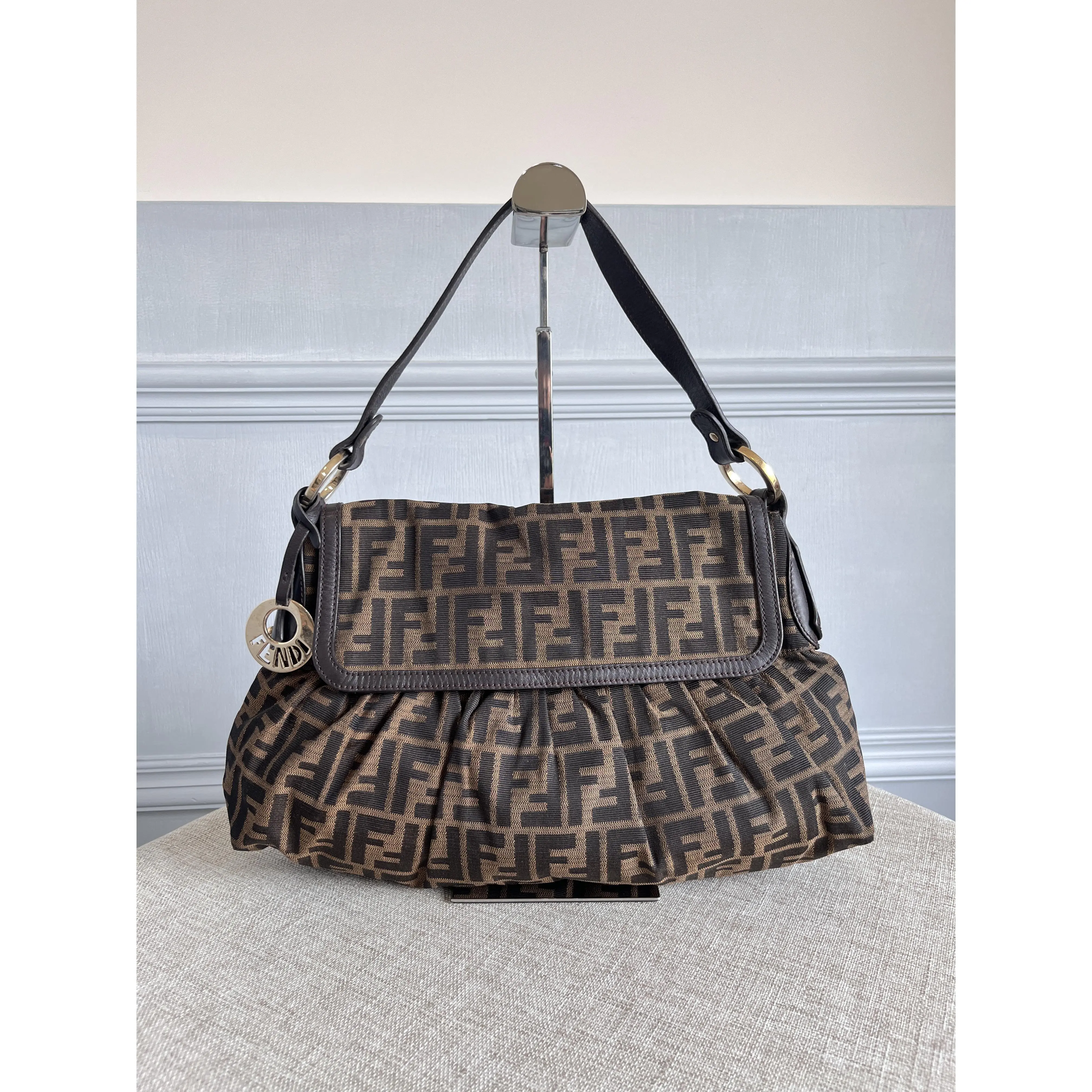 Pre-owned FENDI Authentic Vintage Zucca FF Canvas Ruched Baguette Purse Shoulder Bag Brown Leather Trim, Gold Ring Hardware, FF Logo Charm, Zip, No Pen Marks, Tiny Surface Scratches, Minor Tarnish, Polyester, Handle Leather Free Of Cracks