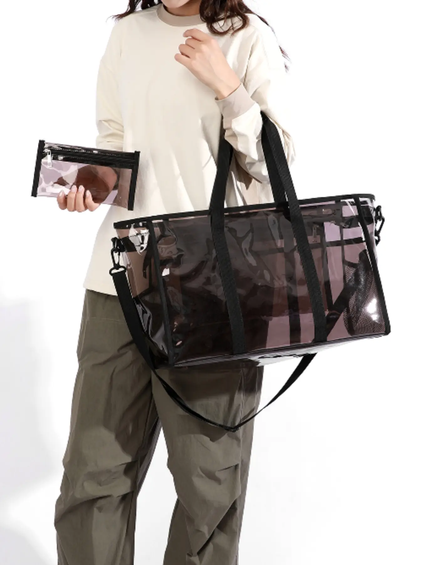 Fashion minimalist transparent travel bag, large-capacity tote bag with side mesh pocket for shoulder or hand carry, includes matching storage pouch and detachable crossbody strap.