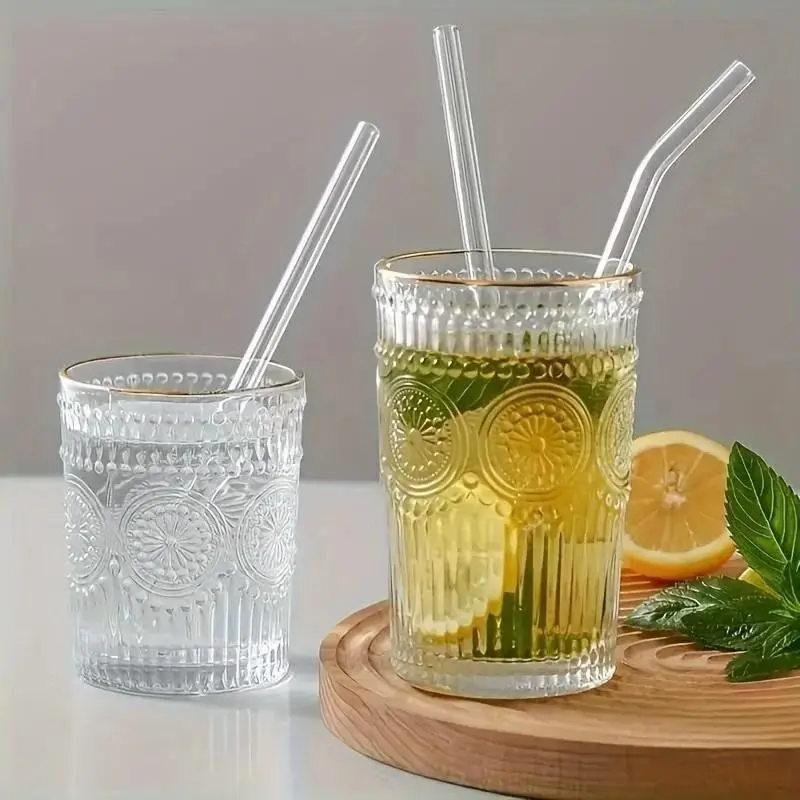 A set of 5 transparent glass straws made from reusable borosilicate material, complete with a cleaning brush. Perfect for use at weddings, beaches, and various festivals. Can be washed in a dishwasher. Drinking straws.