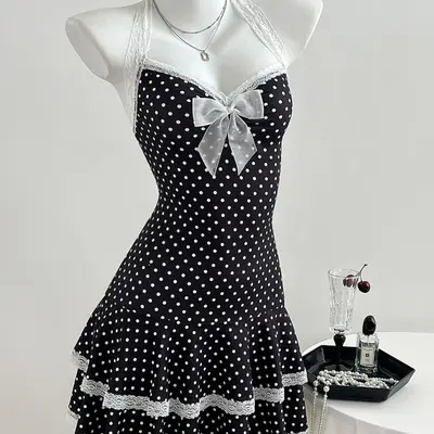 priscilla presley white dress black bow Priscilla Presley's Wedding Dress: All About the Iconic Gown
