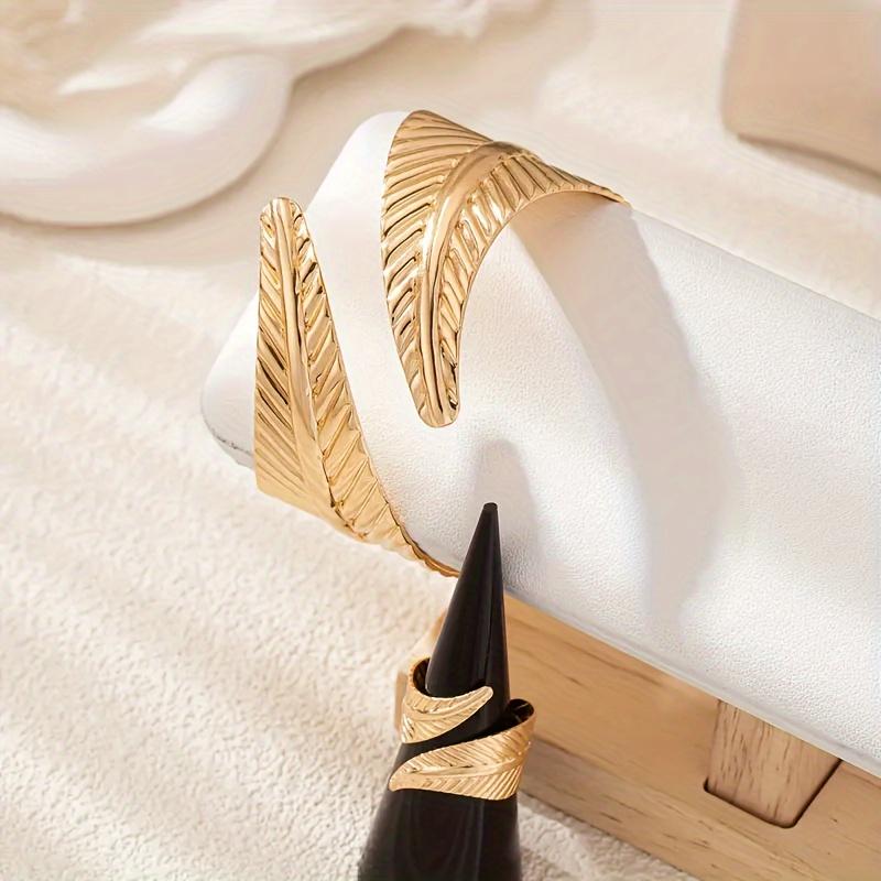 Elegant Gold Feather Textured Cuff Bracelet and Ring Set Nature Inspired Detailed Leaf Pattern Sophisticated Accessory Set for Fashion Enthusiasts and Formal Occasions Cross Necklace Surgical Steel Stud Earrings Mesh Water Drop Plated tiara Silver