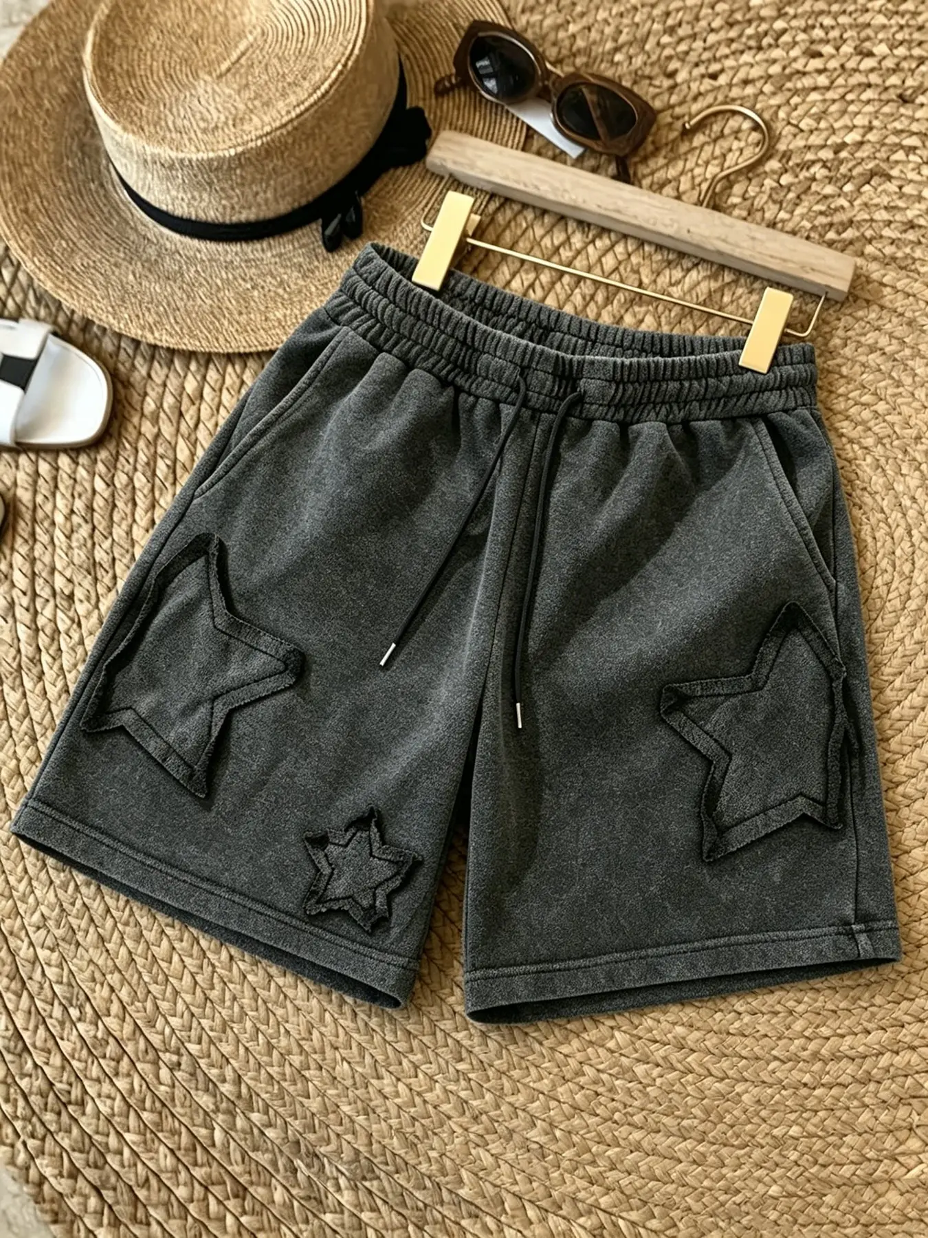 Street-style star-patterned terry cloth athletic shorts, retro washed loose-fitting casual shorts, elastic drawstring waistband, Y2K retro aesthetic everyday casual skateboarding vacation wear.