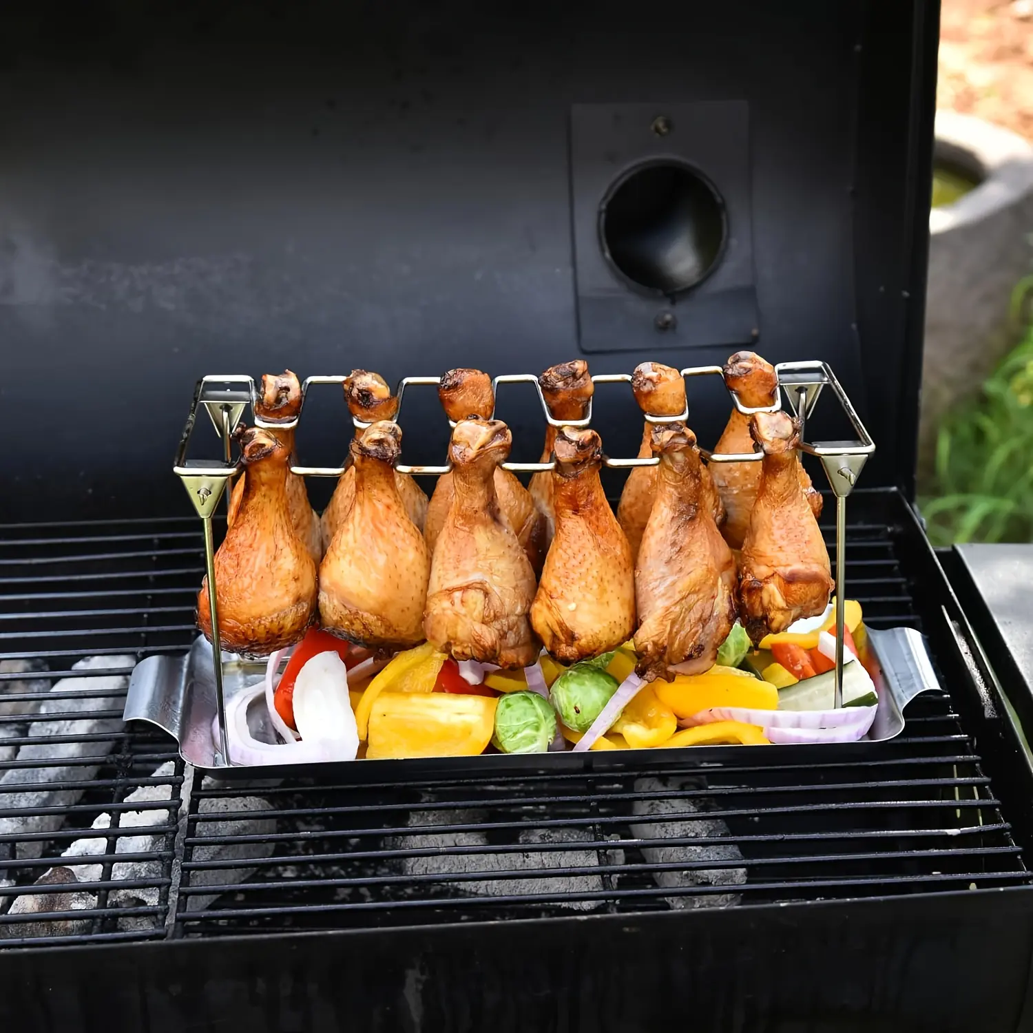 Multi functional stainless steel vertical roasted chicken rack with 14 slots and foldable design. Suitable for barbecue, smoking, and baking. Suitable for picnics, camping, and home use. Easy to store kitchen utensils