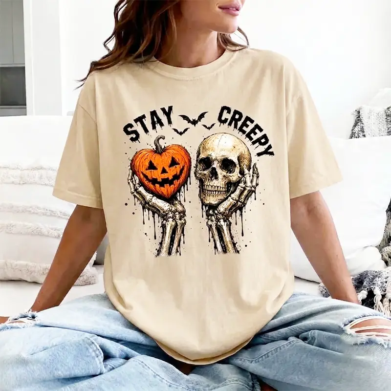 Women's Short-Sleeve Gothic Horror T-Shirt - Vintage Washed Oversized, Creepy Skeleton Hands Holding Jack O' Lantern Skull Bat Drip Splash Graphic, Comfortable Fabrics, Spooky Fall Halloween Streetwear (Great for Birthdays)