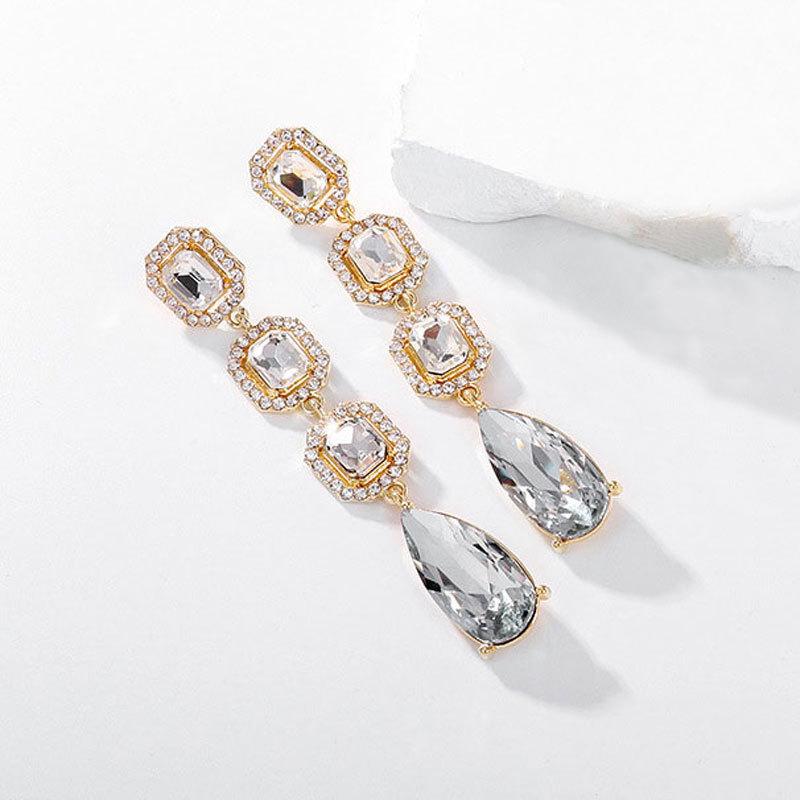 European and American fashion-inspired, premium-designed long-drop-shaped crystal earrings with a dazzling shine. Elegant, versatile, and perfect for cross-border purchases.
