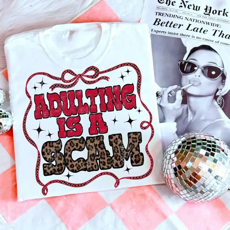 Unisex Oversized Cotton Round Neck T-Shirt - "Adulting Is a Scam" Printed, Everyday Casual Trendy Checkered Western Apparel Top with Adult Mental Health Humor, Leopard Print Gift, Fast Shipping, Tshirt, Women, Streetwear, Casual Wear, Digital Print