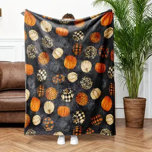 A modern pumpkin print flannel blanket suitable for all seasons - This soft and comfortable digitally printed machine-washable flannel blanket is versatile and ideal for home décor, especially for autumn occasions.