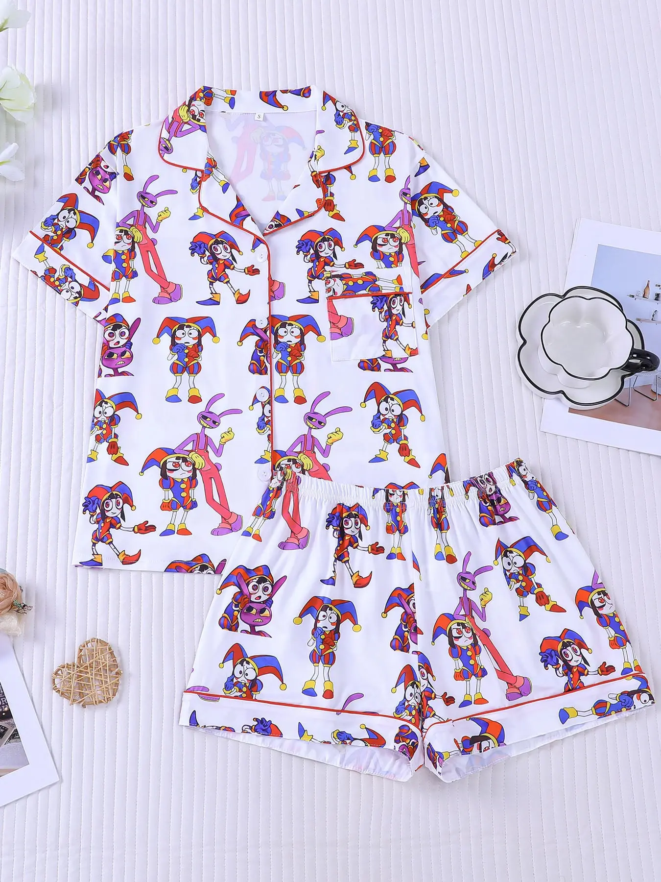 Women's 2-piece Casual Pajamas Set with vibrant The Amazing Digital Circus clown prints, fun anime cartoon style, red contrast piping. Lapel short sleeve top with pocket, soft elastic waist shorts, all-season casual loungewear for women daily home wear