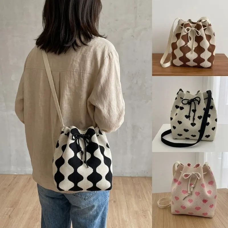 Women's knitted/crocheted bag—a drawstring bucket bag and stylish tote. Versatile design suitable for carrying by hand, over the shoulder, or crossbody. Features a casual, bohemian style perfect for beach vacations, parties, and everyday outings