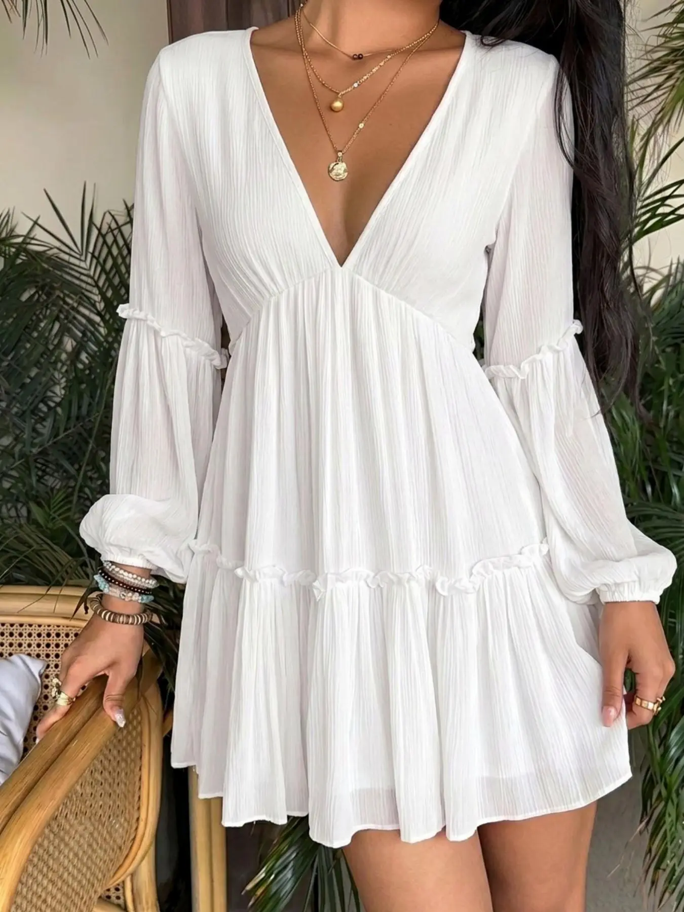 French Textured White V-Neck Layered Ruffled Mini Dress — A Top Beachwear Pick of 2026. Crafted with soft fabric, it is perfect for vacation and brunch outfits. This versatile white ruffled short dress suits casual dating looks and can be worn for daily o