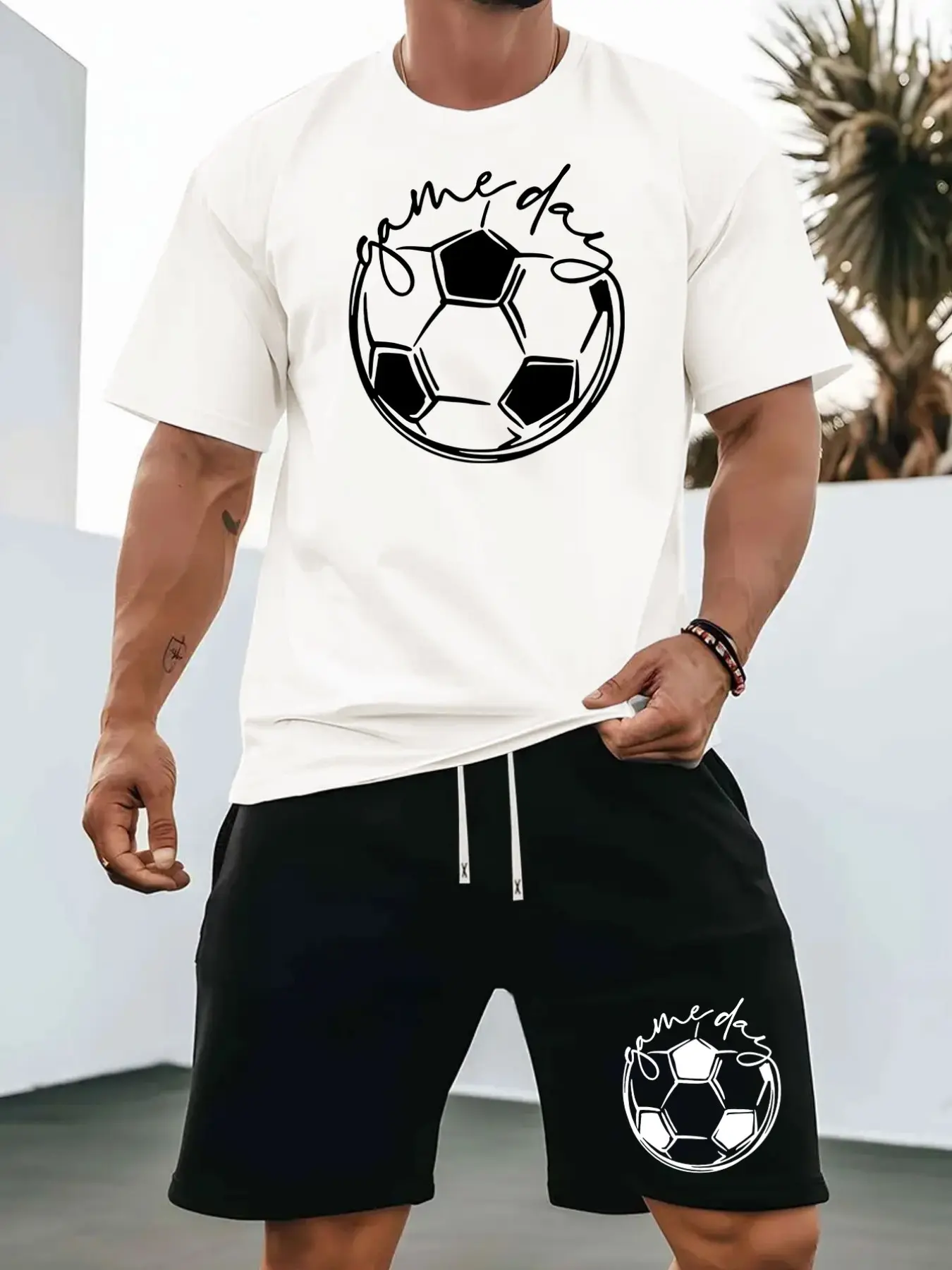 Minimalist loose fit black white football print two piece tracksuit for young adult men ideal for soccer training outdoor hangout everyday viral sports aesthetic wear