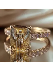 Retro relief large angel icon printed square ring, featuring an artistic scene of a sword-wielding guardian angel, symbolizing peace and protection, a niche and atmospheric decorative jewelry for daily commemoration and gifting among faith enthusiasts