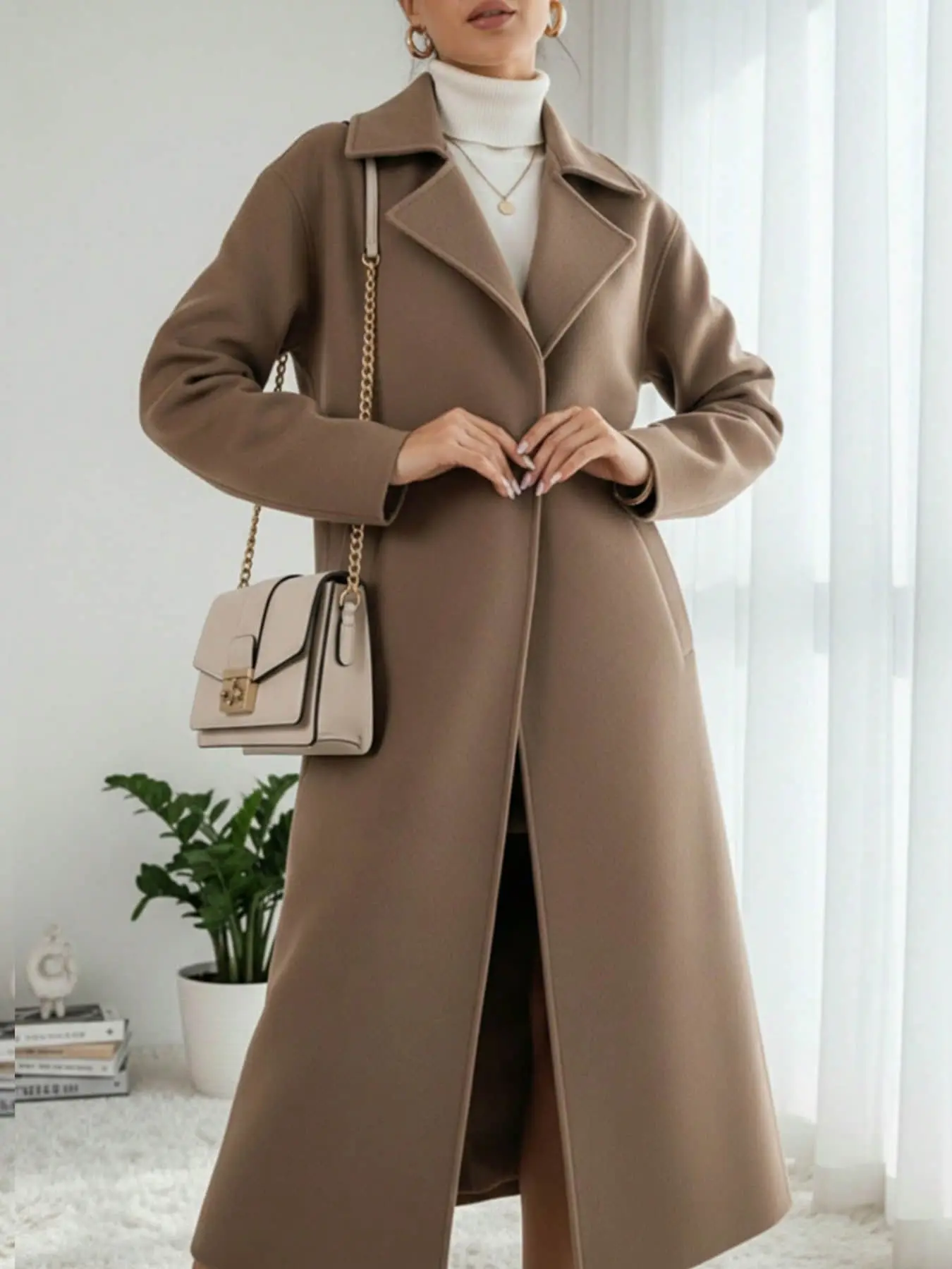A simple and fashionable coat with a feminine fashion temperament, long and loose hanging style, suitable for autumn and winter, suitable for commuting, daily shopping, indoor and outdoor dressing
