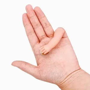 A Terrifying Magic Trick Prop Featuring a Ghostly Hand with a Coin Disappearance Function, Creating a Realistic Floating Hand Illusion. It Has a Faux Light Beige Texture with a Coin Slot, Perfect for Party Magic Performances And Pranks