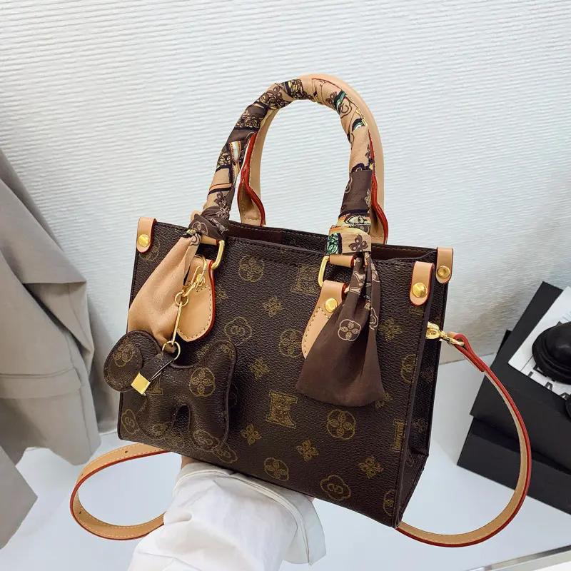 New Women's Affordable Luxury Handbag Compact Portable and Versatile Features a Retro Monogram Print and a Sophisticated Aesthetic Suitable for Hand-Carrying Shoulder or Crossbody Wear Fashion Purse Fashion Patterned Bag