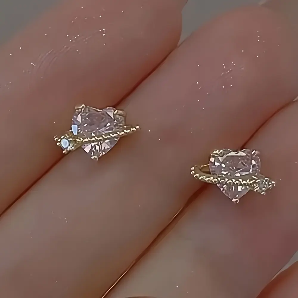 A Pair of Stylish Heart-Shaped Crystal Earrings Made of Zinc Alloy with Silvery Studs, Featuring Japanese And Korean Designs, Perfect for Everyday Use, Parties, And As Gifts for Anniversaries