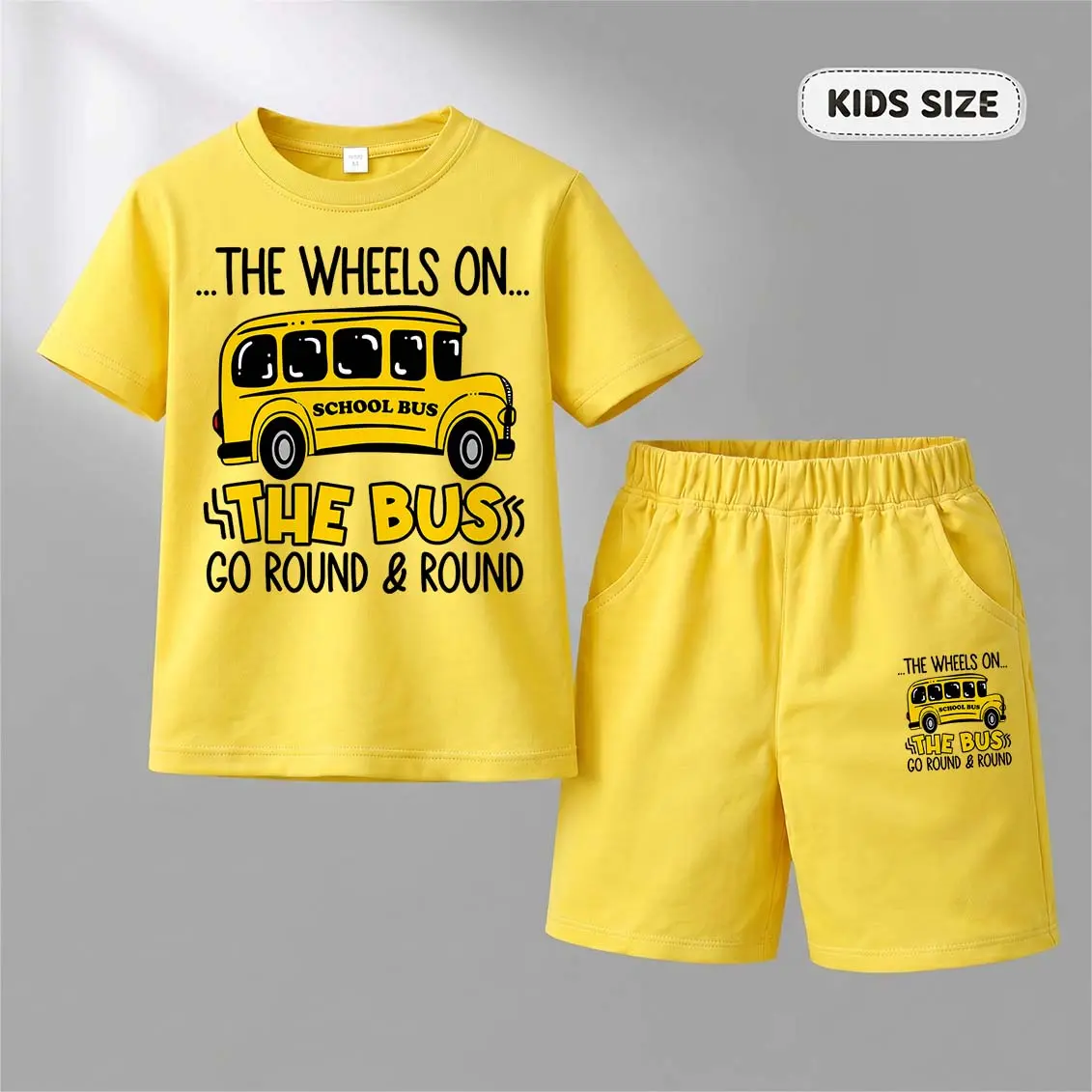 Kids’ “he Wheels on the Bus Cartoon Print Short-Sleeve T-Shirt And Shorts Set—Casual Summer Kids' Clothing. This Round-Neck Outfit Combination Is Perfect For Everyday Wear And Outdoor Play.