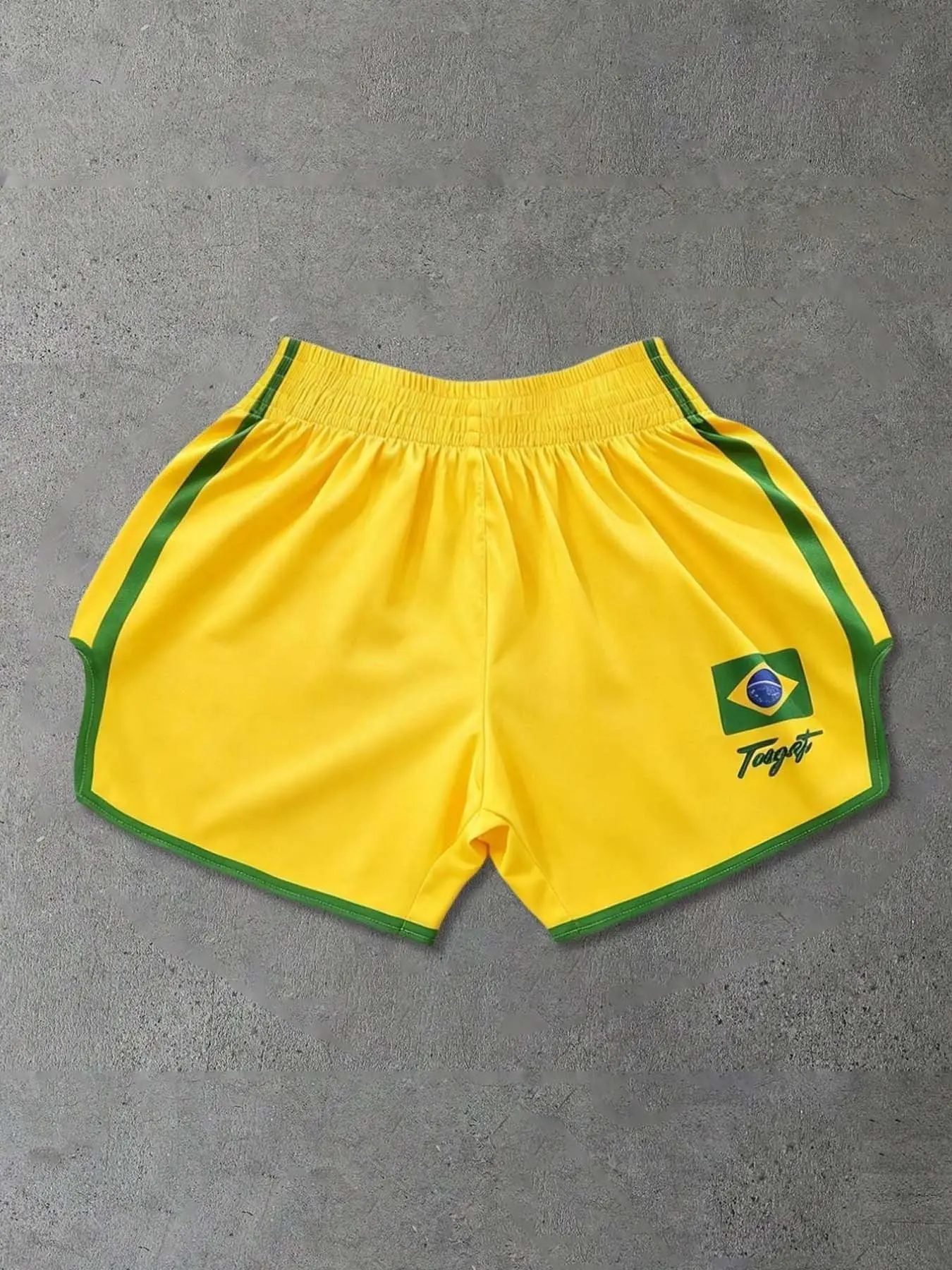 Brazil flag yellow sports shorts with green trim, elastic waistband, and split hem, made of loose, breathable, quick-dry fabric, perfect for gym, beach, and summer bottoms. #BrazilStyle