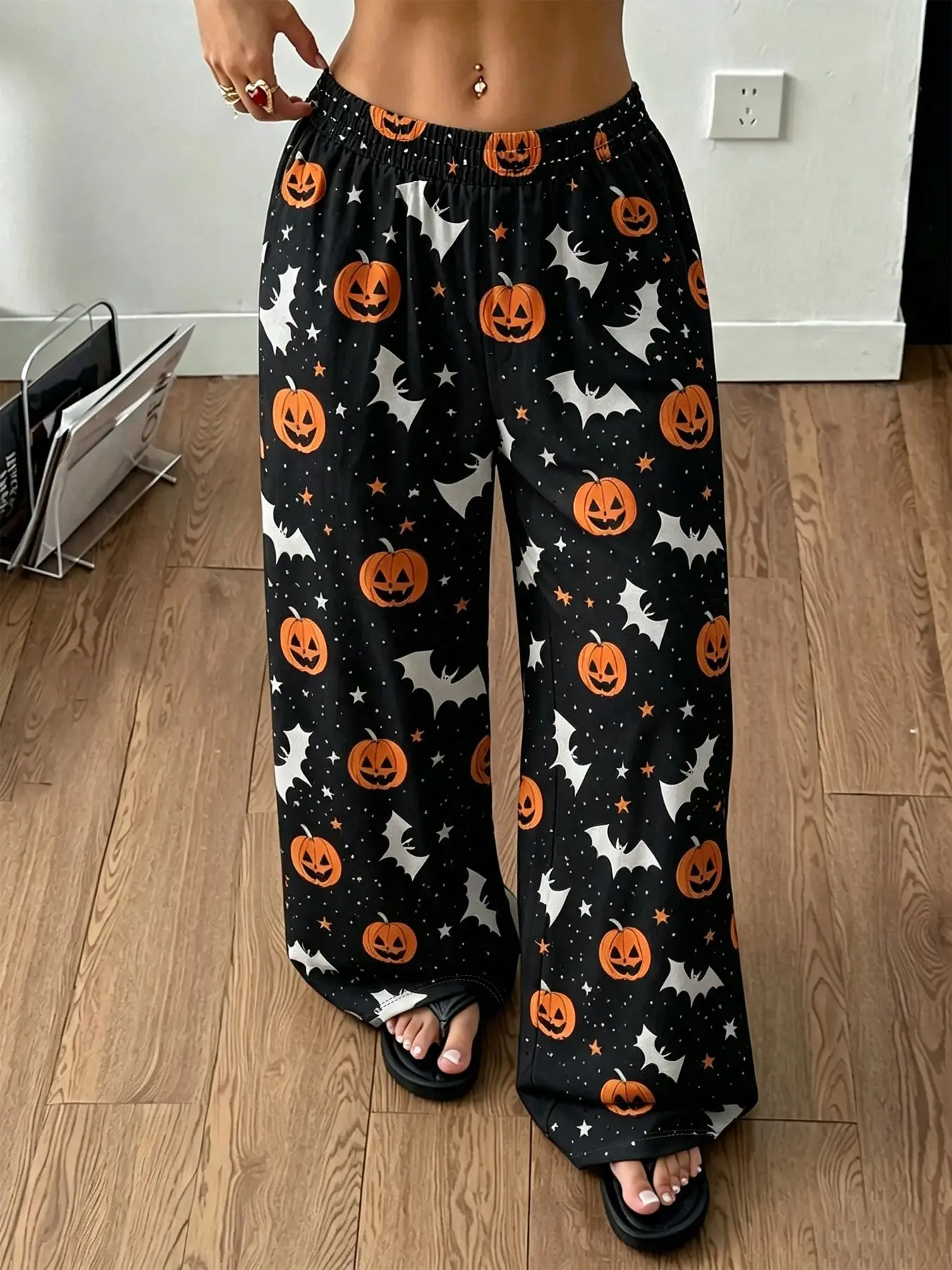Women's cute, versatile casual pants featuring a Halloween pumpkin and bat print; loose-fitting lounge/sleep pants with an elastic waistband—perfect for everyday wear. Pajamas