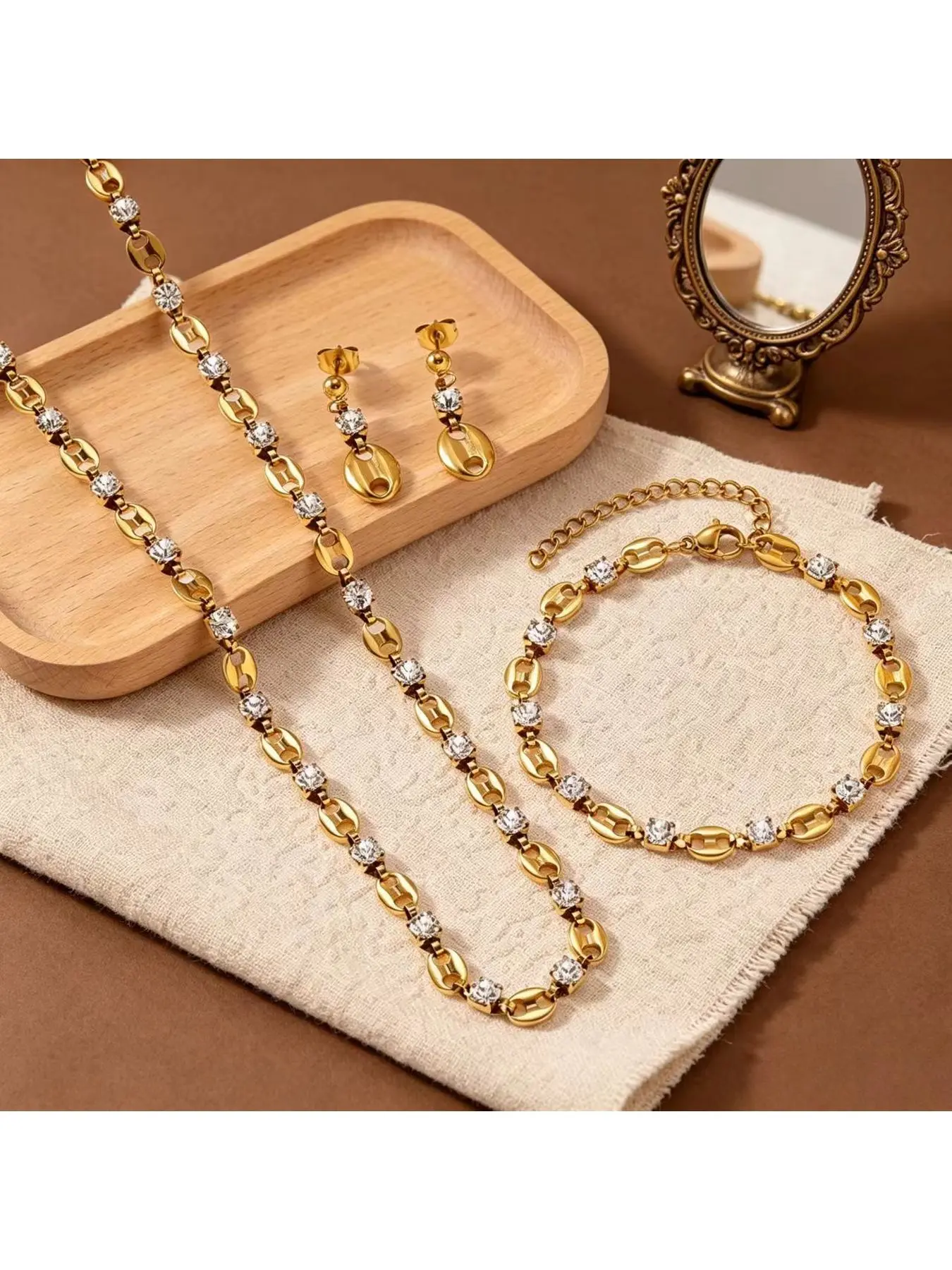 Luxury pig nose diamond-encrusted titanium steel jewelry set for women, 18k gold necklace, bracelet, and earrings three-piece set, women's gift