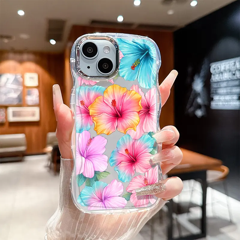 Tropical hibiscus floral pattern phone case featuring a shock-resistant, non-slip TPU frame with a wavy edge and an electroplated lens surround; compatible with iPhone 17, 16, 15, 14, 13, 12, 11, XS, X, and other series models.