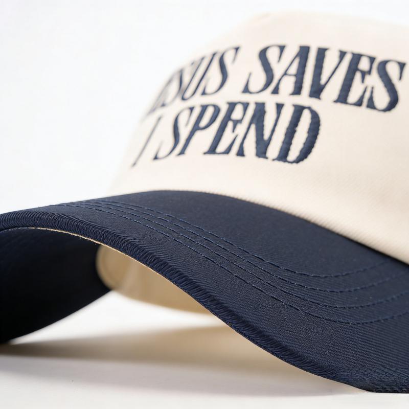 2026 trendy hat, featuring the embroidered "JESUS SAVES ISPEND" pattern, a baseball cap with a contrasting color design, adjustable and unisex unisex hat