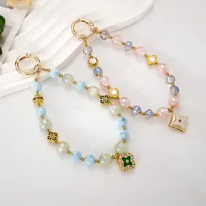 New Chinese-style rotatable alloy four-leaf clover pendant phone charm, creative national-style faceted beaded bag charm