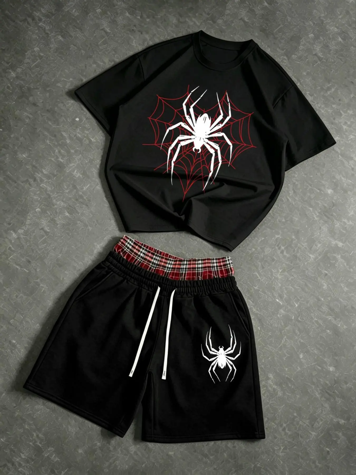 Men's two-piece summer suit: a crew neck spider web pattern Graphic T-shirt and a pair of red plaid drawstring shorts with a spider print at the waist. The shorts are double-layered.