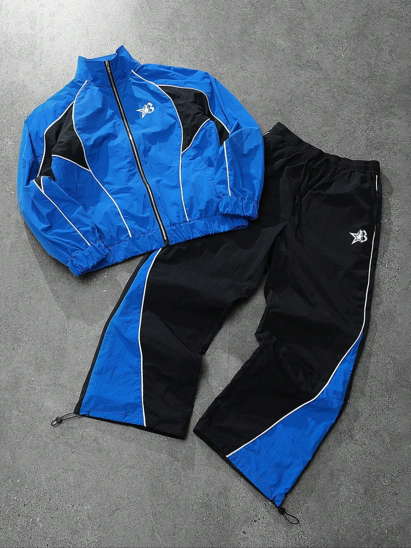 Y2K Blue-Black Color-Block Tracksuit, Athletic clothes set, Lightweight zip-up jacket, adjustable drawstring loose pants, bold electric blue and black contrasting star logo, unisex loose fit, windproof casual sportswear, everyday skate aesthetic outfit