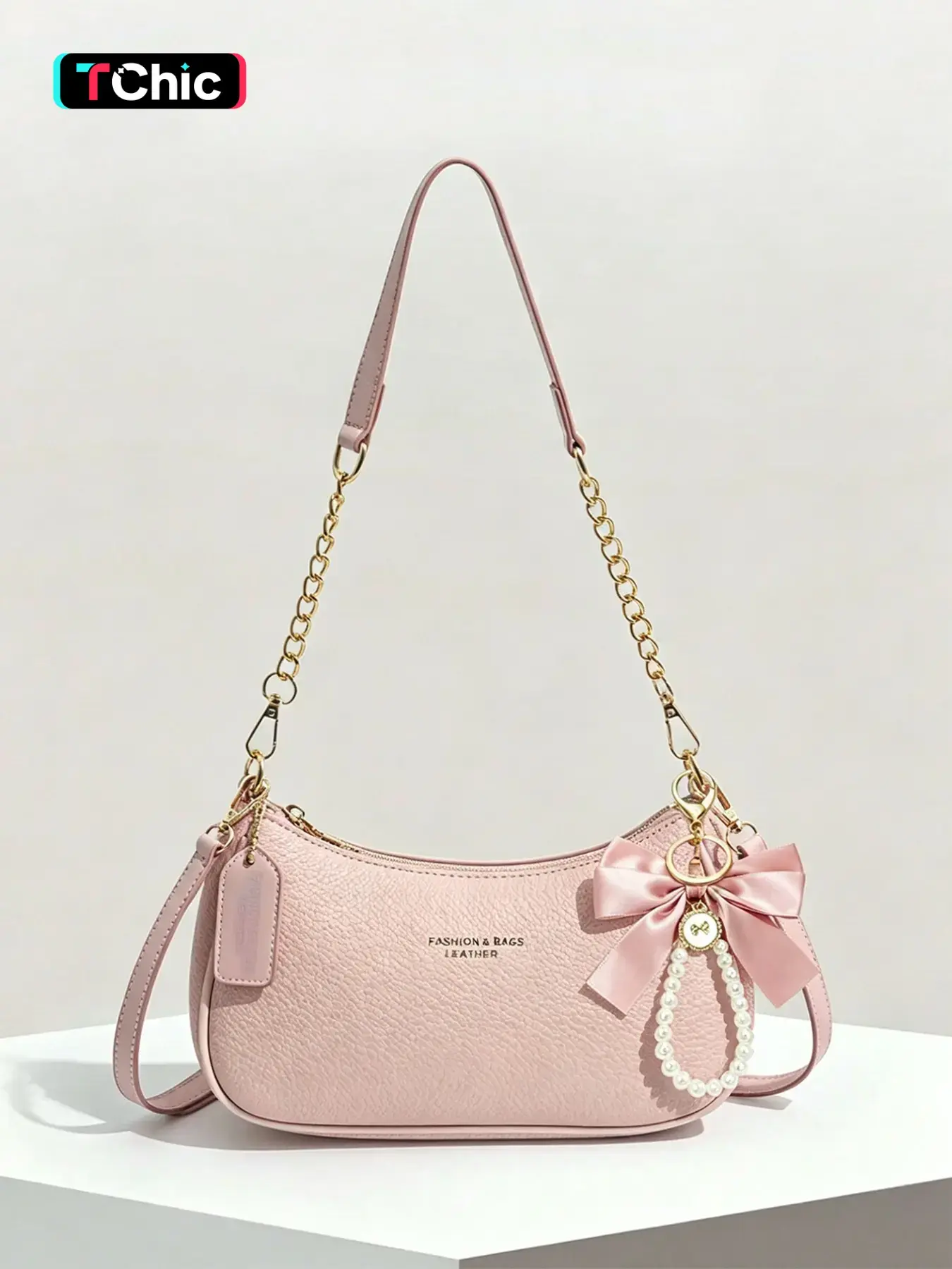 Gentle, sweet, fashionable and practical texture underarm bag with bow and pearl hanging decoration, chain splicing shoulder strap design, crescent shaped stick design, fashionable Casual Crossbody bag, suitable for commuting and dating, Casual Trendy Bag