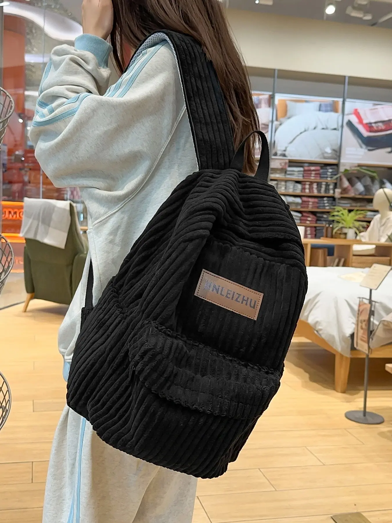 Back-to-school season niche design corduroy vertical stripe backpack with large capacity and weight-reducing shoulder straps, stylish and versatile for commuting, going out, or traveling, available in multiple colors, lightweight Casual Daypack.