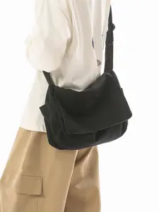 Simple and casual street-style large-capacity canvas shoulder bag, with side pockets, adjustable strap, lightweight daily commute messenger bag.