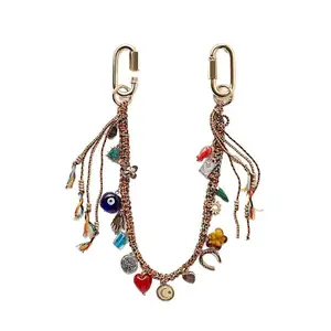 Trendy Woven Evil Eye Keychain with Geometric Metal Heart Pendant, Unique Personality Hand Braided Rope Bag Charm Protection Amulet Key Accessories Gift for Women Teen Girls
