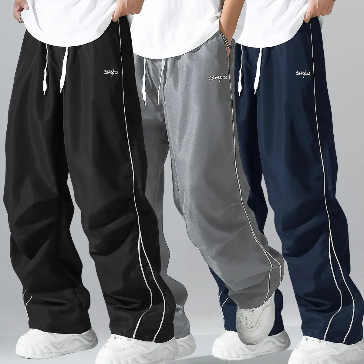 Loose Fit Men's Trousers with Grey Side Stripes and Gold Trim Stripes Comfortable Design Sports and Casual Style Bottoms Sweatpants Fitness Wear Fashionable and Versatile