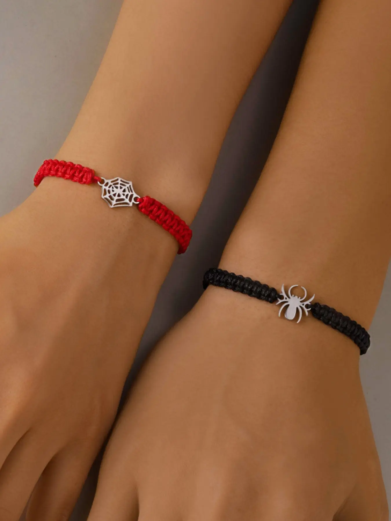 Spider-Man Couple Bracelet Set, red & black handmade braided bracelets with spiderweb charms, adjustable unisex fit. Perfect friendship bracelets, Halloween accessories, Valentine & back-to-school gifts, superhero jewelry for couples & best friends.