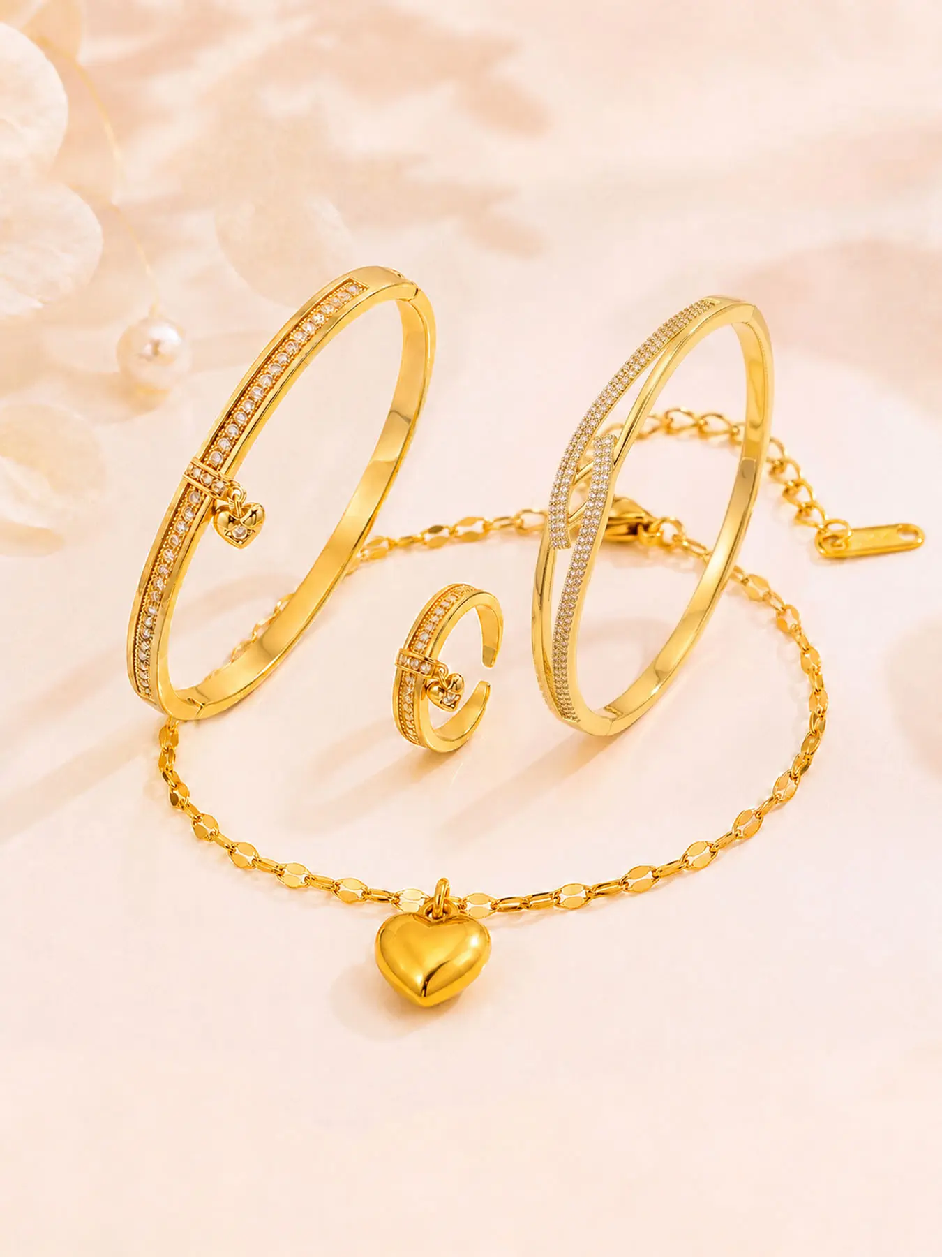 4-piece set with double-line full rhinestone bracelet, ring, and bangle stackable set. Makes your skin look fair, shapes your hands, and makes them appear slender and delicate. Perfect for everyday outfits, both stylish and versatile.
